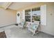 Charming covered porch with comfortable seating, perfect for relaxing and enjoying the outdoors at 3294 Shelby St, The Villages, FL 32162