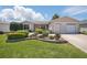 Charming single-story home featuring well-maintained landscaping, a two-car garage, and inviting curb appeal at 3294 Shelby St, The Villages, FL 32162