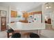 Bright kitchen featuring a breakfast bar, ample counter space, and modern white appliances at 3294 Shelby St, The Villages, FL 32162