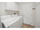 Neat laundry area with washer and dryer, offering convenience at 3294 Shelby St, The Villages, FL 32162