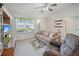 Comfortable living room with a ceiling fan and lots of natural light at 3294 Shelby St, The Villages, FL 32162