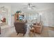 Inviting living room featuring a ceiling fan and large windows at 3294 Shelby St, The Villages, FL 32162