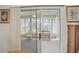 Bright sunroom with large sliding glass doors, white trim, and vertical blinds at 3294 Shelby St, The Villages, FL 32162