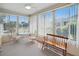 Comfortable sunroom with a table and chairs, a bright bench, and lots of natural light at 3294 Shelby St, The Villages, FL 32162