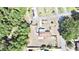 Aerial view of a home featuring fenced yard, mature trees, and a well-maintained landscape at 33415 Picciola Dr, Fruitland Park, FL 34731