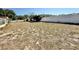 Vast backyard featuring white fence, providing privacy and ample space for recreation or gardening at 33415 Picciola Dr, Fruitland Park, FL 34731