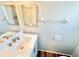 Clean bathroom with updated vanity, sink, mirror, and flooring offers a modern and fresh appeal at 33415 Picciola Dr, Fruitland Park, FL 34731