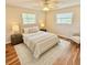 Comfortable bedroom with bright lighting, hardwood floors, and a relaxed feel at 33415 Picciola Dr, Fruitland Park, FL 34731