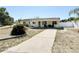 Charming home with a covered porch and long driveway at 33415 Picciola Dr, Fruitland Park, FL 34731