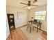 Bright office featuring hardwood floors, a modern desk, and ample natural light at 33415 Picciola Dr, Fruitland Park, FL 34731