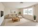 Bright living room featuring neutral tones, natural light, and modern furnishings at 33415 Picciola Dr, Fruitland Park, FL 34731