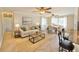 A stylish living and dining area with modern furniture and hardwood floors at 33415 Picciola Dr, Fruitland Park, FL 34731
