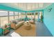 Spacious sun room with bright walls, comfortable seating, and expansive windows at 33415 Picciola Dr, Fruitland Park, FL 34731