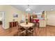 Bright dining area adjacent to the kitchen, with a view into the laundry room at 3396 Greenacres Ter, The Villages, FL 32163