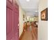 Inviting entryway with wood-look floors leading to the living area at 3396 Greenacres Ter, The Villages, FL 32163