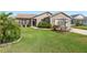 Well-maintained single-story home with landscaped front yard and inviting curb appeal at 3396 Greenacres Ter, The Villages, FL 32163