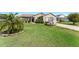 Well-maintained single-story home with landscaped front yard and inviting curb appeal at 3396 Greenacres Ter, The Villages, FL 32163