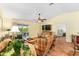 Comfortable living room with a ceiling fan and a slider to an outdoor patio at 3396 Greenacres Ter, The Villages, FL 32163