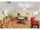 Open-concept living room featuring vaulted ceilings and sliding glass doors to the lanai at 3396 Greenacres Ter, The Villages, FL 32163