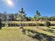 Lush green backyard with beautiful mature trees at 34004 Sky Blossom Cir, Leesburg, FL 34788