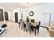 This dining room features neutral tones, stylish decor, and a spacious table at 34004 Sky Blossom Cir, Leesburg, FL 34788