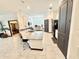 Spacious kitchen with an island, stainless steel appliances, and open to the adjacent living area at 34004 Sky Blossom Cir, Leesburg, FL 34788
