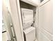 Space-saving stacked washer and dryer unit inside a closet at 34004 Sky Blossom Cir, Leesburg, FL 34788