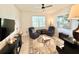 Comfortable living room features lots of natural light, two chairs, and a decorative rug at 34004 Sky Blossom Cir, Leesburg, FL 34788