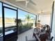 Relaxing covered front porch with comfortable seating and neighborhood view at 34004 Sky Blossom Cir, Leesburg, FL 34788
