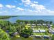 Breathtaking aerial view showcasing waterfront property with lush trees and easy access to the serene lake at 34407 Island Dr, Leesburg, FL 34788