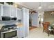 Well-appointed kitchen features modern stainless steel appliances, plentiful storage, and adjacent dining area at 34407 Island Dr, Leesburg, FL 34788