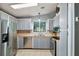 Modern kitchen features stainless steel appliances, gray cabinets, and butcher block countertops at 34407 Island Dr, Leesburg, FL 34788