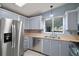 Beautiful kitchen with stainless steel appliances and ample cabinet space, perfect for cooking and entertaining at 34407 Island Dr, Leesburg, FL 34788