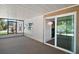 Enclosed porch with sliding door leading to outdoor space and scenic views at 34407 Island Dr, Leesburg, FL 34788