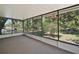 Screened sunroom with views of the waterfront and boat dock at 34407 Island Dr, Leesburg, FL 34788