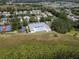 Community pool and tennis courts offer residents many recreational opportunities in a well-landscaped area at 3723 Belle Rose Dr, Leesburg, FL 34748