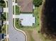 Birds eye view of a property showcasing mature trees, landscaping, and street at 3723 Belle Rose Dr, Leesburg, FL 34748