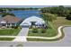 Lovely home with meticulous landscaping and a scenic backdrop of a serene lake at 3723 Belle Rose Dr, Leesburg, FL 34748