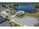 Beautiful lake view property with well-kept lawn, palm trees, and desirable neighborhood charm at 3723 Belle Rose Dr, Leesburg, FL 34748