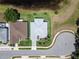 Overhead view of a charming single-Gathering home with manicured lawn and detailed landscaping at 3723 Belle Rose Dr, Leesburg, FL 34748