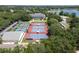 Aerial image of tennis courts and clubhouse showcasing community recreational facilities at 3723 Belle Rose Dr, Leesburg, FL 34748