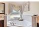 Relaxing soaking tub area with decor at 3723 Belle Rose Dr, Leesburg, FL 34748