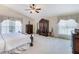 Expansive bedroom featuring neutral tones, ceiling fan, and ample natural light at 3723 Belle Rose Dr, Leesburg, FL 34748