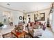 Spacious living room featuring an open floor plan and elegant furnishings at 3723 Belle Rose Dr, Leesburg, FL 34748