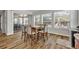 Dining room with a view of outdoor space, hardwood floors, and six chairs at 4060 Longbow Dr, Clermont, FL 34711