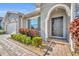 Charming front entrance with landscaped walkway and a stylish black front door at 4060 Longbow Dr, Clermont, FL 34711