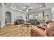 Spacious living room with tray ceiling, and access to the outdoor patio at 4060 Longbow Dr, Clermont, FL 34711