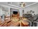 Comfortable living room with tray ceiling, and access to the kitchen at 4060 Longbow Dr, Clermont, FL 34711