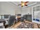 Office space with a ceiling fan, built-ins, and bright window at 4060 Longbow Dr, Clermont, FL 34711