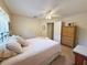Bedroom featuring a bed, nightstand, ceiling fan and carpeted floor at 4387 Sambourne St, Clermont, FL 34711